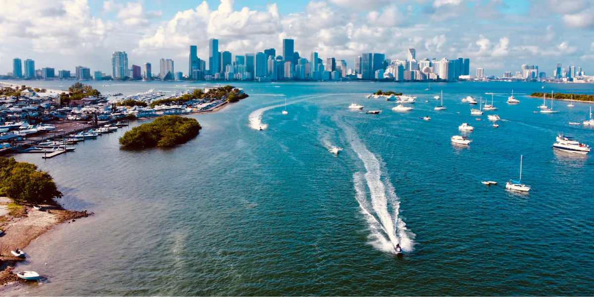 Boats crossing Biscayne Bay with the Downtown Miami skyline